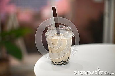 Pearl milk tea in a cup at the cafe Stock Photo