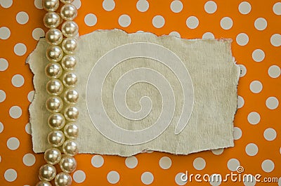 Pearls and orange dotted background Stock Photo