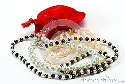 Pearls and red pocket Stock Photo