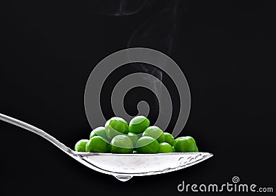 Peas in spoon Stock Photo