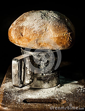 Peasant bread on a flour board Stock Photo