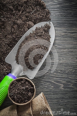 Peat glasses soil spade on wood board Stock Photo