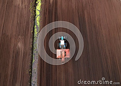 Peat Harvester Tractor on Collecting Extracting Peat. Mining and harvesting peatland. Area drained of the mire are used for peat Stock Photo