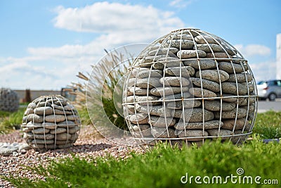 Pebble stone sphere for garden decoration Stock Photo