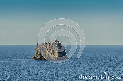 Pebble strombolicchio in front of stromboli island Stock Photo
