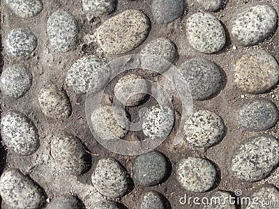 pebbles laid out for road dividers Stock Photo