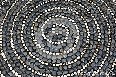 Pebbles mosaic floor with spiral pattern Stock Photo