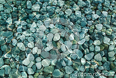 Pebbles and rocks under water background Stock Photo