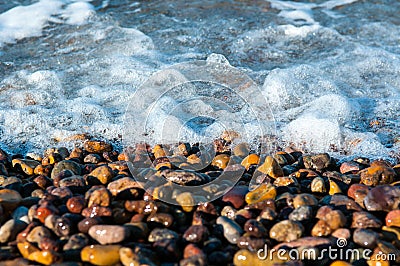 Pebbles in a shore of an island Stock Photo