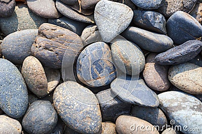 Pebbles stones Natural background at seashore Stock Photo