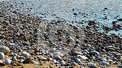 pebbles washed by the waves on the beac Stock Photo