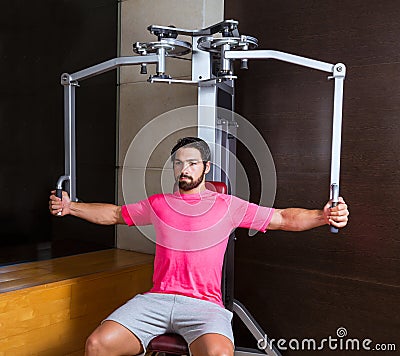 Pec-deck flye pec deck chest workout man Stock Photo