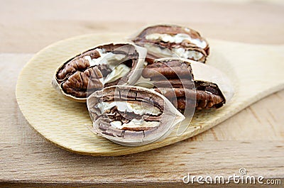 Pecan close-up macro high resolution on wooden plate Stock Photo