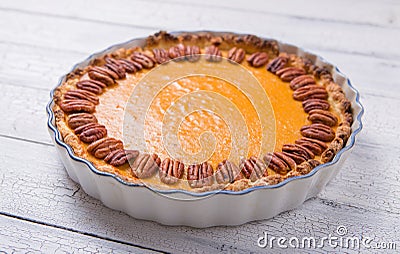 Pecan, Pumpkin, Thanksgiving Holiday Pies on a rustic table with decorative gourds. Top view Stock Photo