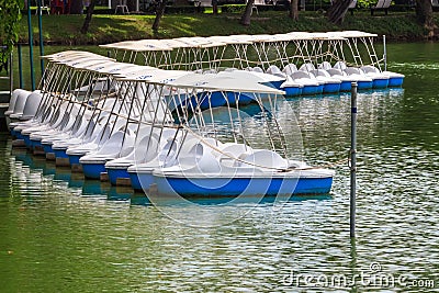 Pedal Boats locked at Peaceful Lake Marina Stock Photo