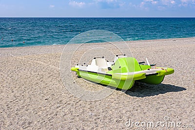 Pedalo on a gravel beach Stock Photo