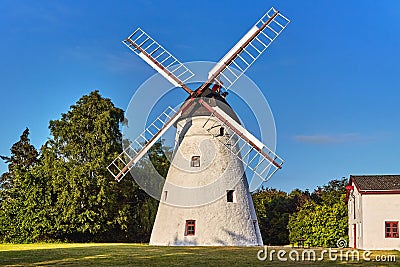 Pedersker Kirkemolle - the oldest standing stone Dutch windmill on the island of Bornholm. Editorial Stock Photo