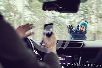 Pedestrian accident - man using a phone while driving a car Stock Photo