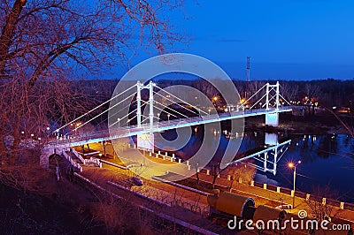 Pedestrian bridge across the river Ural night. Orenburg Stock Photo