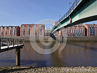 Pedestrian bridge across the river Weser connecting Bremen`s historic Schlachte district wit Stock Photo