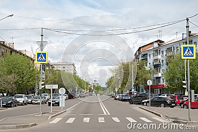 Pedestrian crossing at the beginning of the Paris Commune street in Krasnoyarsk city on a spring day Editorial Stock Photo