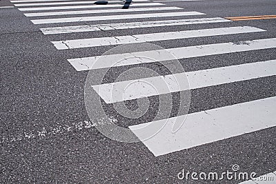 Pedestrian crossing with road marking. White lines on the dark a Stock Photo