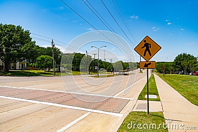 pedestrian crossing sign. road sign of pedestrian crossing. caution yellow roadsign. traffic sign on the road. attention Stock Photo