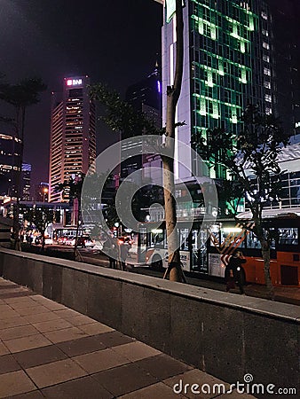 Pedestrian near BNI tower next to BNI Mrt Station, Jakarta. Editorial Stock Photo