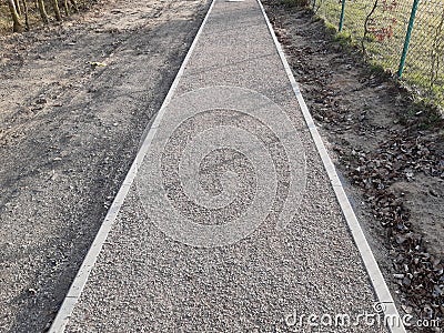 pedestrian path newly built compacted stone aggregate permeable surface soft for runners pedestrian cycle path forest path Stock Photo