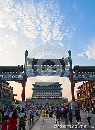 Pedestrian street Qianmen, traditional Chinese arch, walking people, blue sky, Beijing, China Editorial Stock Photo