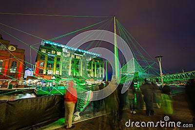 Pedestrian traffic and light display at the Inner Harbor in Baltimore, Maryland Editorial Stock Photo