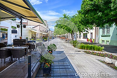 Pedestrian zone with bar and restaurant terraces in centre of spa town Piestany SLOVAKIA Stock Photo