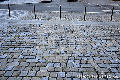 In the pedestrian zone, the entrance is regulated by black decorative steel posts. the post can be tilted to the ground for passer Stock Photo