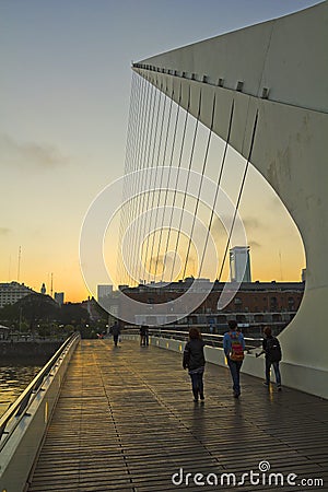 Pedestrians crossing the Bridge of the Woman. Puerto Madero neighborghood or disctrict in Buenos Aires city, Argentina Editorial Stock Photo