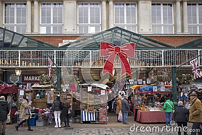 Pedestrians look at different stalls at Jubilee Market Hall Editorial Stock Photo