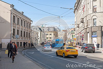 Pedestrians, taxi, trolleybus and cars in Moscow Editorial Stock Photo