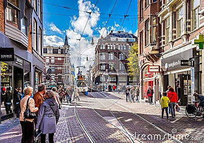 Pedestrians and Trams on the busy Leidsestraat in the center of Amsterdam Editorial Stock Photo