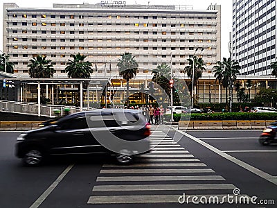 pedestrians are waiting on zebra crossing to cross the street Editorial Stock Photo