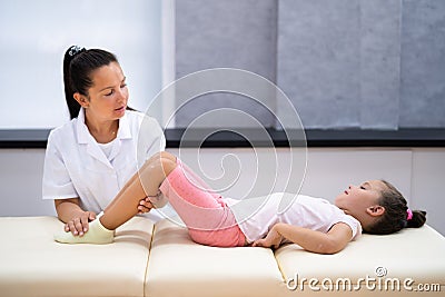 Pediatric Chiropractor And Orthopedic Foot Physio Stock Photo