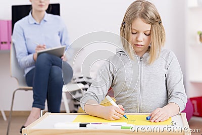 Pediatric occupational therapist observing patient Stock Photo