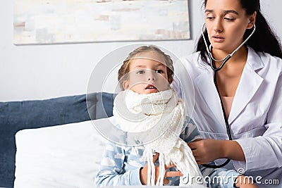 Pediatrician girl, wrapped in warm scarf Stock Photo