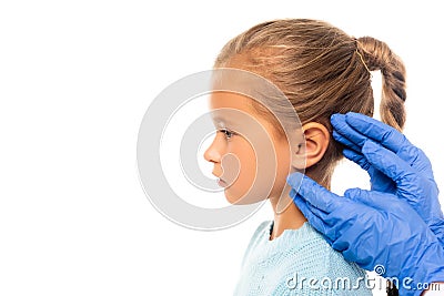Pediatrician in gloves touching ear of Stock Photo