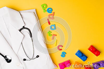 Pediatrics against a yellow background Stock Photo