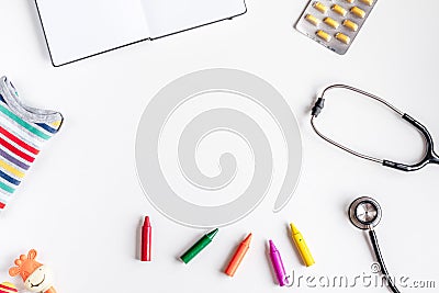 Pediatrics equipment with crayons , stethoscope white background top view space for text Stock Photo