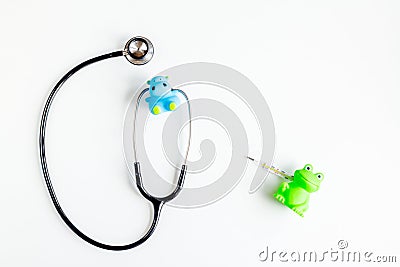Pediatrics equipment with toys, stethoscope white background top view space for text Stock Photo