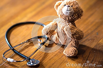 Pediatrics: stethoscope and toy bear Stock Photo