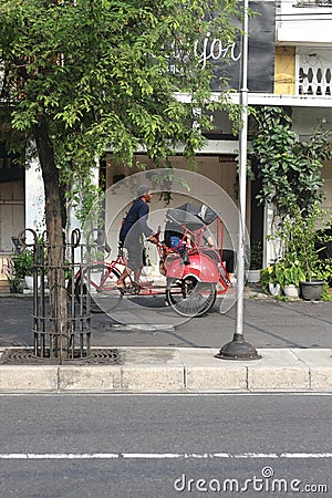 Pedicab drivers carrying passengers Editorial Stock Photo