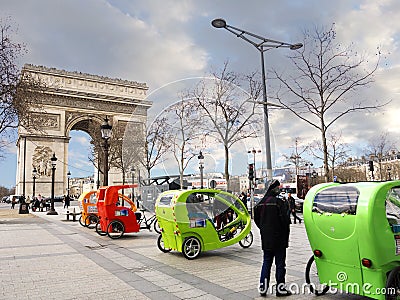 Pedicabs near Arc de Triomphe Paris france Editorial Stock Photo