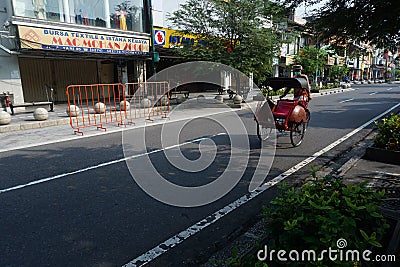 Pedicap driver on the Malioboro street when pandemi covid-19 Editorial Stock Photo