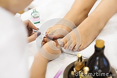 Pedicure at beauty salon. Nail polishing. Stock Photo